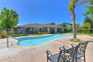 Exterior Community Pool Area, Meticulous landscaping in and around the pool area, gated pool, pool behind clubhouse.